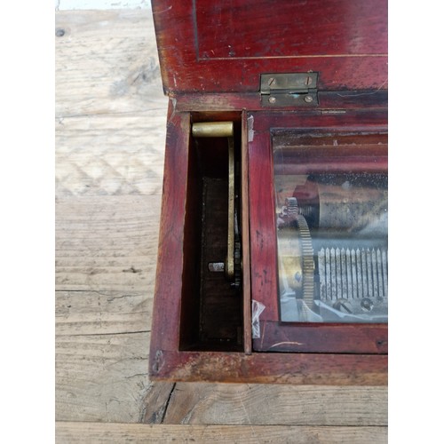 32 - A late 19th century rosewood cylinder music box, length 51.5cm.