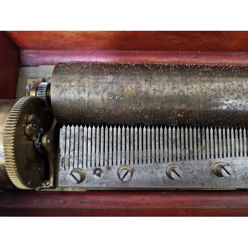 32 - A late 19th century rosewood cylinder music box, length 51.5cm.