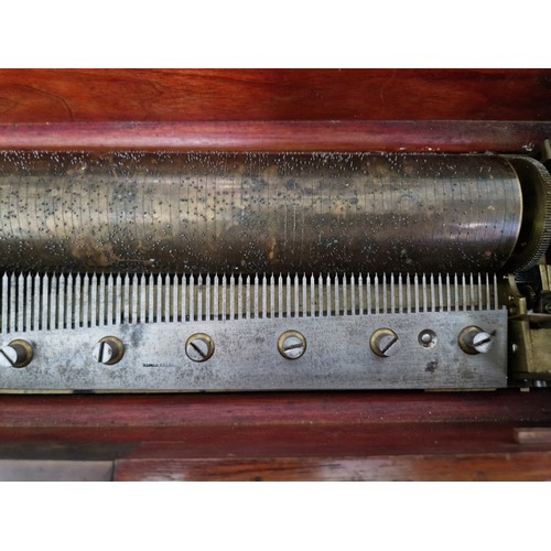 32 - A late 19th century rosewood cylinder music box, length 51.5cm.