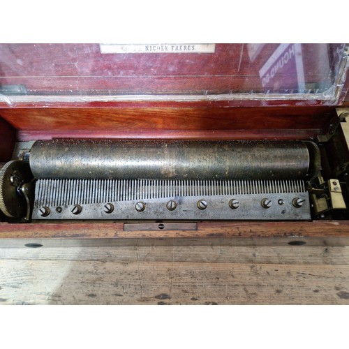 32 - A late 19th century rosewood cylinder music box, length 51.5cm.