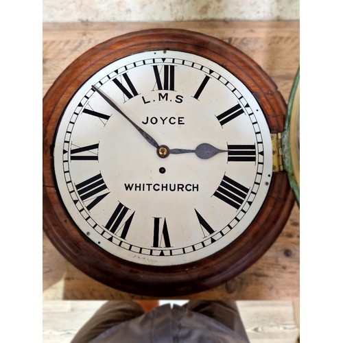 211 - A mahogany case fusee railway clock, L.M.S. Joyce, Whitchurch, diameter 45cm.