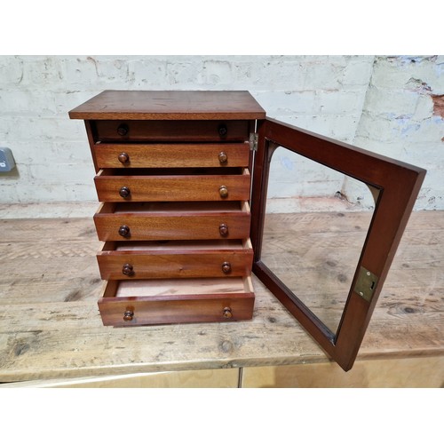 34 - A late Victorian specimen cabinet, interior drawers with arched glazed door, labelled 'Watkins & Don... 