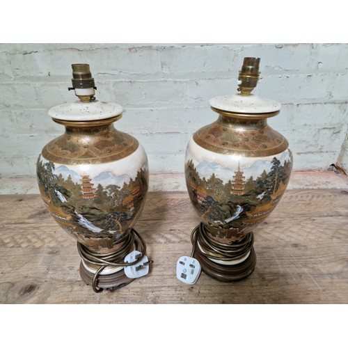 273 - A pair of Japanese Satsuma lamp bases (converted from vases), height 41cm.