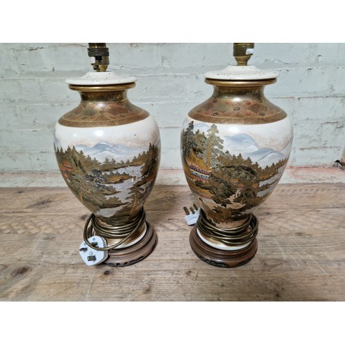 273 - A pair of Japanese Satsuma lamp bases (converted from vases), height 41cm.