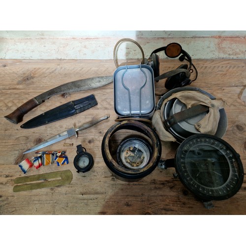 400 - A box of assorted militaria including a 1939 MKIII prismatic compass, Canadian army mess tins, brass... 