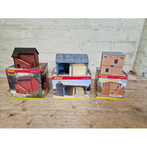 395 - Three boxes of assorted model railway including scenery, Hornby buildings and track.