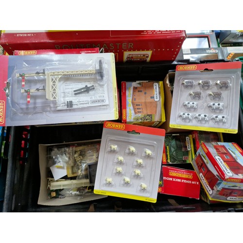 395 - Three boxes of assorted model railway including scenery, Hornby buildings and track.