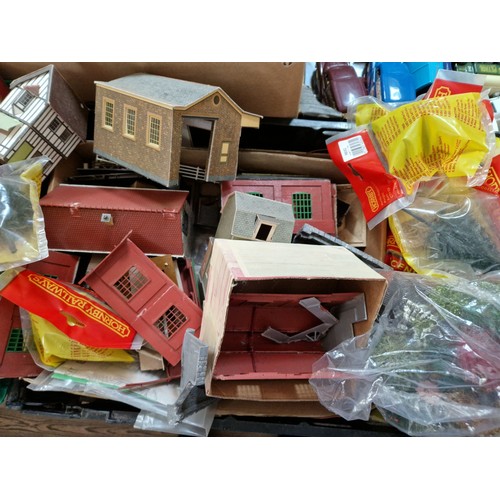 395 - Three boxes of assorted model railway including scenery, Hornby buildings and track.