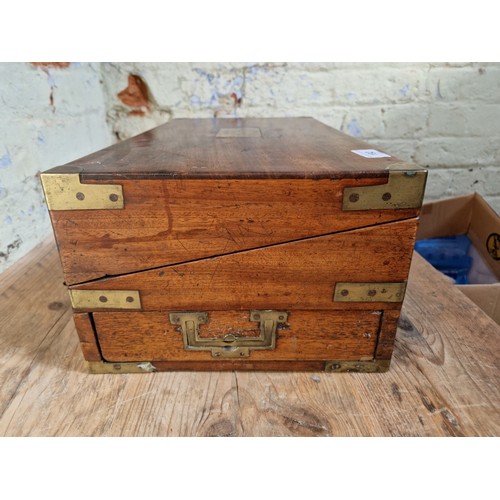 192 - A 19th century mahogany writing slope, campaign style with inset brass handles and brass inlaid corn... 