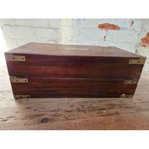 192 - A 19th century mahogany writing slope, campaign style with inset brass handles and brass inlaid corn... 