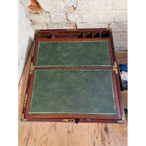 192 - A 19th century mahogany writing slope, campaign style with inset brass handles and brass inlaid corn... 