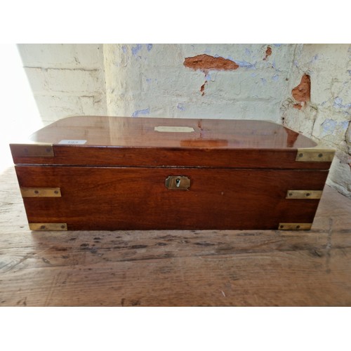 193 - A 19th century mahogany writing slope with campaign style inset brass handles and inlaid brass corne... 