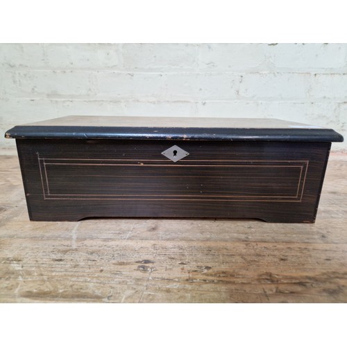 33 - A late 19th century 8 airs rosewood cylinder music box, length 43cm.