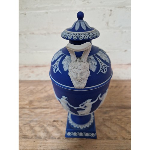 278 - Wedgwood comprising a pair of lidded urns, a pedestal vase and two Dancing Hour figures.