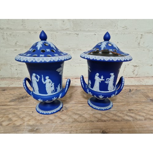 278 - Wedgwood comprising a pair of lidded urns, a pedestal vase and two Dancing Hour figures.