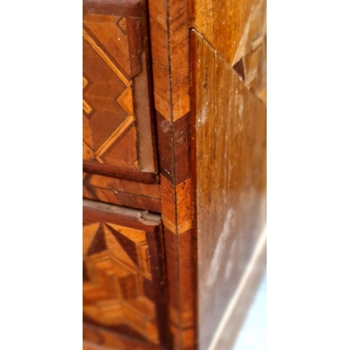 289 - A Japanese parquetry inlaid cabinet, height 36cm.