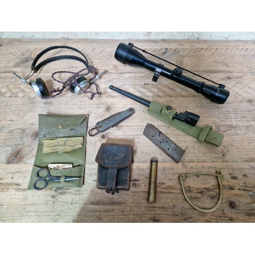 106 - A box of militaria to include headphones, various related items, whistles, scope, a William Rodgers ... 