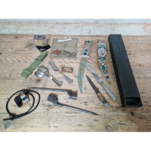 106 - A box of militaria to include headphones, various related items, whistles, scope, a William Rodgers ... 