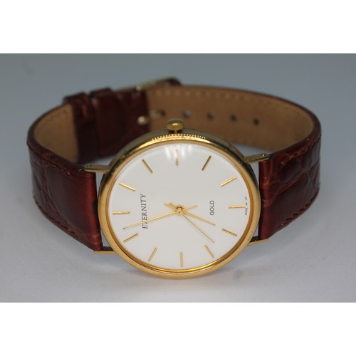 93 - A 9ct gold Eternity wristwatch, case diam. 35mm, leather strap.