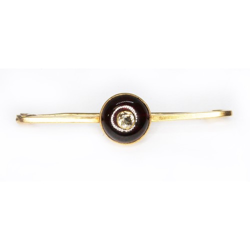 64 - An antique diamond and garnet bar brooch, the bezel measuring approx. 11mm in diameter, maker's init... 