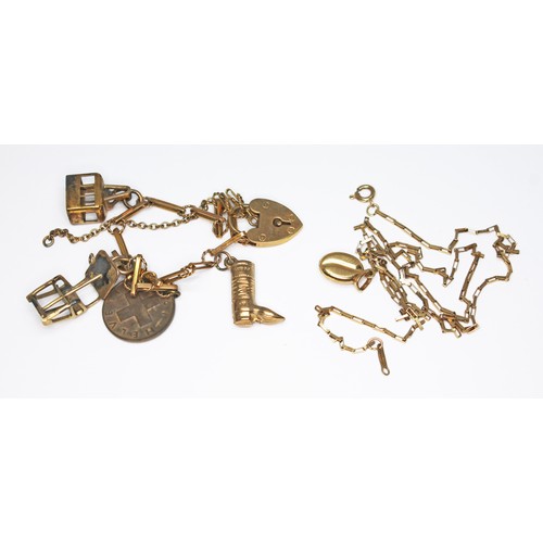 69 - A 9ct gold charm bracelet with two gilt metal charms marked '800', one hallmarked 9ct gold and a coi... 