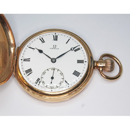 79 - An Omega 9ct gold half hunter pocket watch, signed enamel dial with Roman numerals and seconds subsi... 