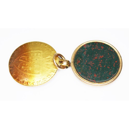 52 - A bloodstone locket pendant fob, formed from a George III 1791 guinea, hinged and opening to reveal ... 