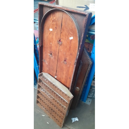 238 - A bagatelle board, an octagonal wood framed mirror and a thimble display rack