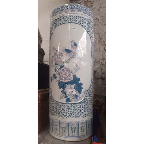 242 - A Chinese ceramic stick stand, decorated with birds and flowers.