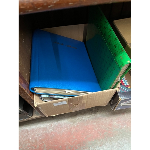 77 - A box containing stamp albums and Benham silks.