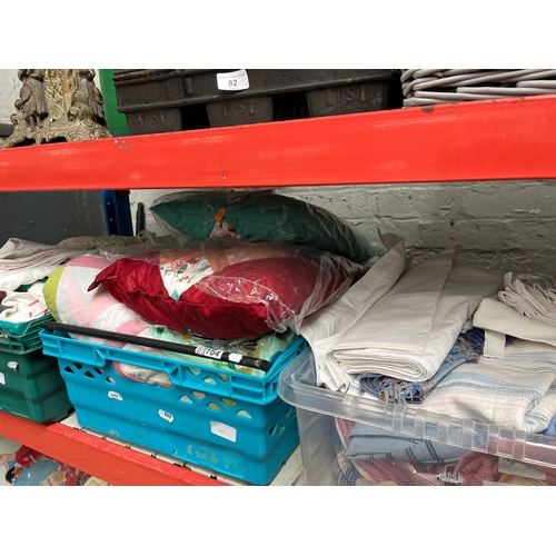 85 - Three boxes of assorted linen, material and cushions