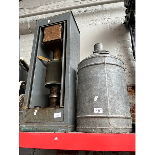 108 - A paraffin heater and a galvanised drum.