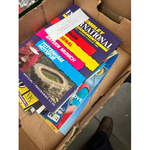 141 - A box of approximately 40 friendly football programmes.