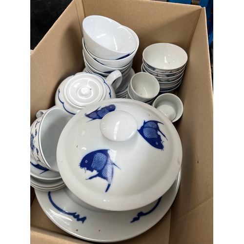 185 - A box of Chinese blue and white ceramics decorated with fish.