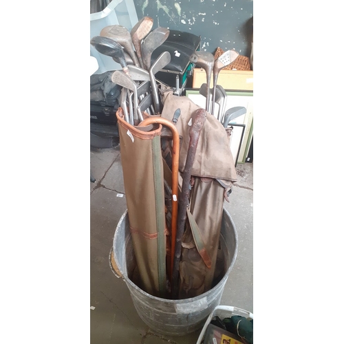 275 - 2 bags of golf vintage clubs and 3 walking sticks