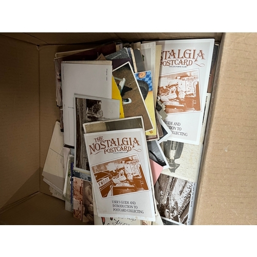 68 - A box of old photographs and postcards