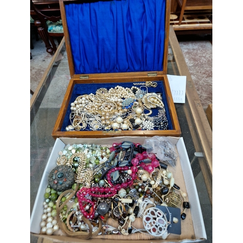 286 - Two boxes of costume jewellery.