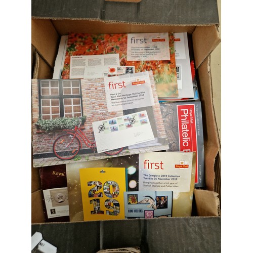 347 - A box of loose stamps, a box of magazines and a box of supplementary sheets.