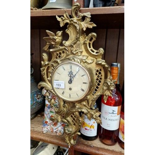 153 - A Smiths 8 day gilt cartel wall clock, 48cm in height.