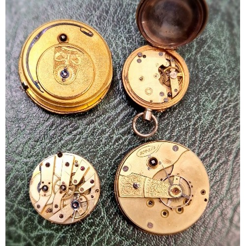 438 - A box of pocketwatch movements and keys.