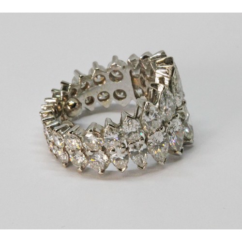 8 - A diamond eternity ring, formed from a double row of diamonds comprising eighteen pear cut diamonds ... 