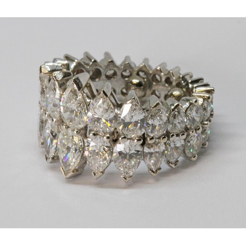 8 - A diamond eternity ring, formed from a double row of diamonds comprising eighteen pear cut diamonds ... 