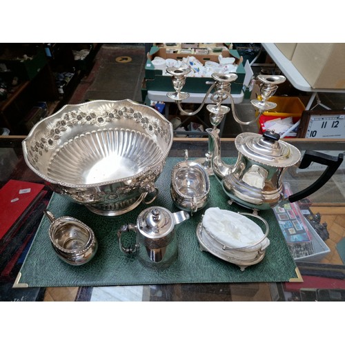 181 - A large quantity of plated ware in two boxes including coffee pots, tray, punch bowl etc