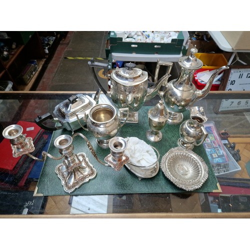 181 - A large quantity of plated ware in two boxes including coffee pots, tray, punch bowl etc