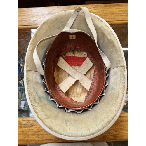 32 - An early 20th century pith helmet.