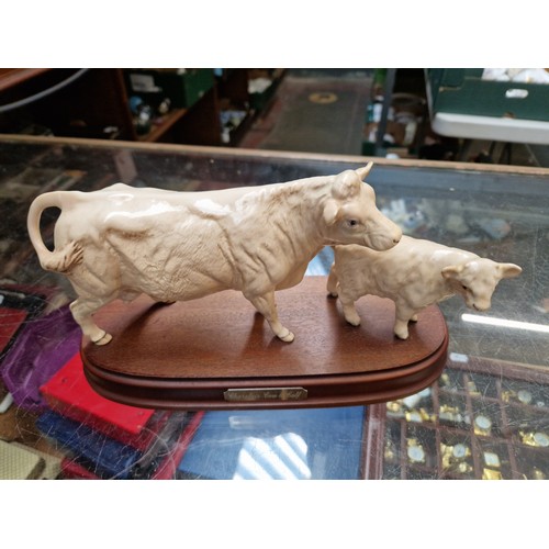 511 - Beswick cattle figures, Charolais bull figure (matt finish), Charolais cow and calf on wooden plinth