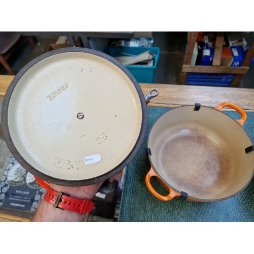 75 - Three Le Creuset volcano orange cooking pans