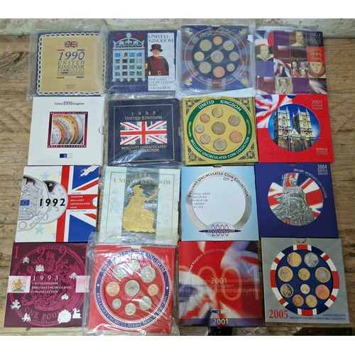 63 - A collection of 16 UK BU coin sets 1990 -2005.