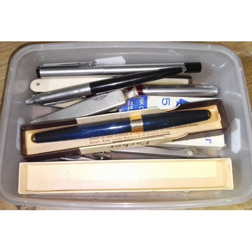 397 - A box of assorted pens and penknives.