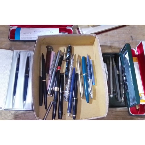 398 - A box of assorted pens and pencils